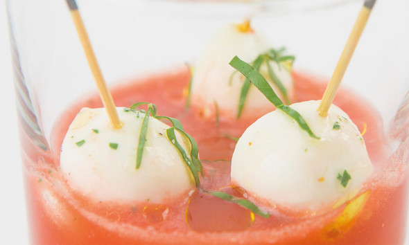Cold tomato soup with Mozzarelline and basil